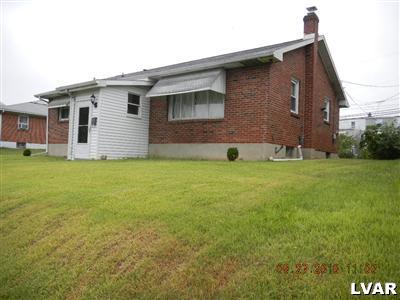 1111 Ridge Avenue Allentown, PA 18102 - Photo 2 of 10 a brick house with a yard