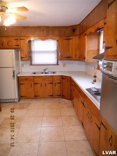 1111 Ridge Avenue Allentown, PA 18102 - Photo 4 of 10 a large kitchen with a cabinets and a sink