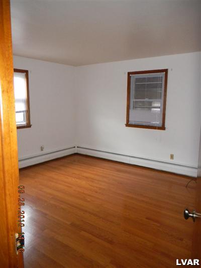 1111 Ridge Avenue Allentown, PA 18102 - Photo 9 of 10 a view of a room with an empty room and wooden floor