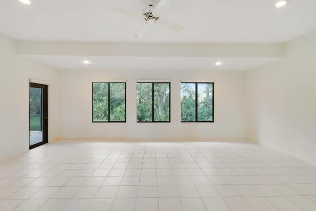 a view of a hallway with chandelier and entryway