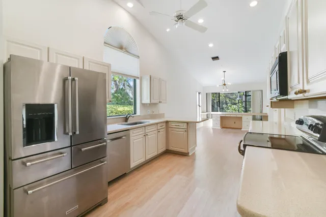 an aerial view of a house with a yard and garden