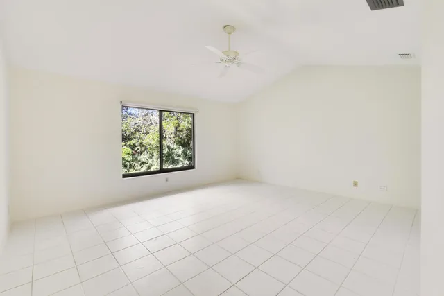 a view of a park with large trees