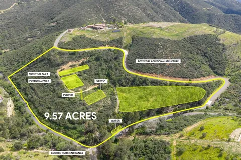 an aerial view of a highlighted house