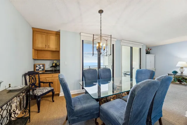a kitchen with granite countertop white cabinets and sink