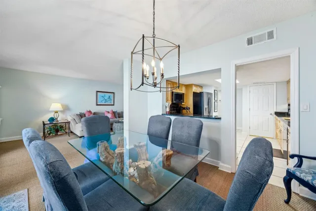 a kitchen with stainless steel appliances granite countertop a refrigerator stove and microwave