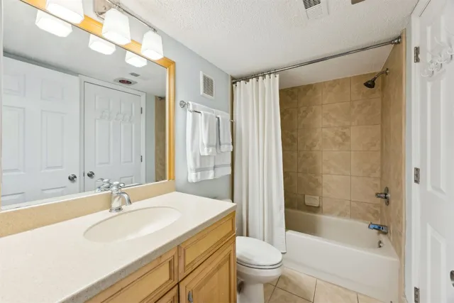 a view of a chairs and table in patio with wooden floor