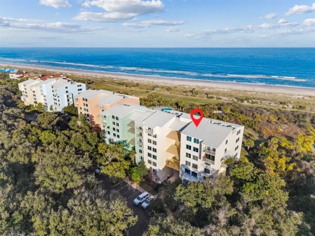 a view of a lake with a house in the background