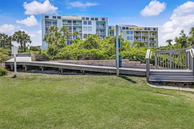 a sign that is in front of flowers