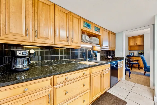 a living room with furniture and a lamp