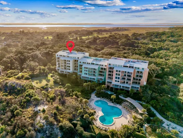 a living room with furniture a flat screen tv and a couch