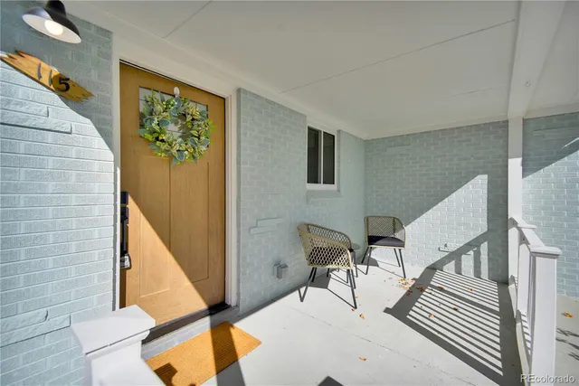 a view of a livingroom with furniture and stairs
