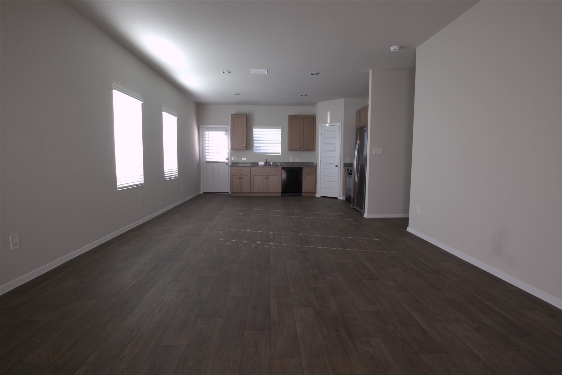 13410 Riding Drive Manor, TX 78653 - Photo 2 of 4 an empty room with windows and closet