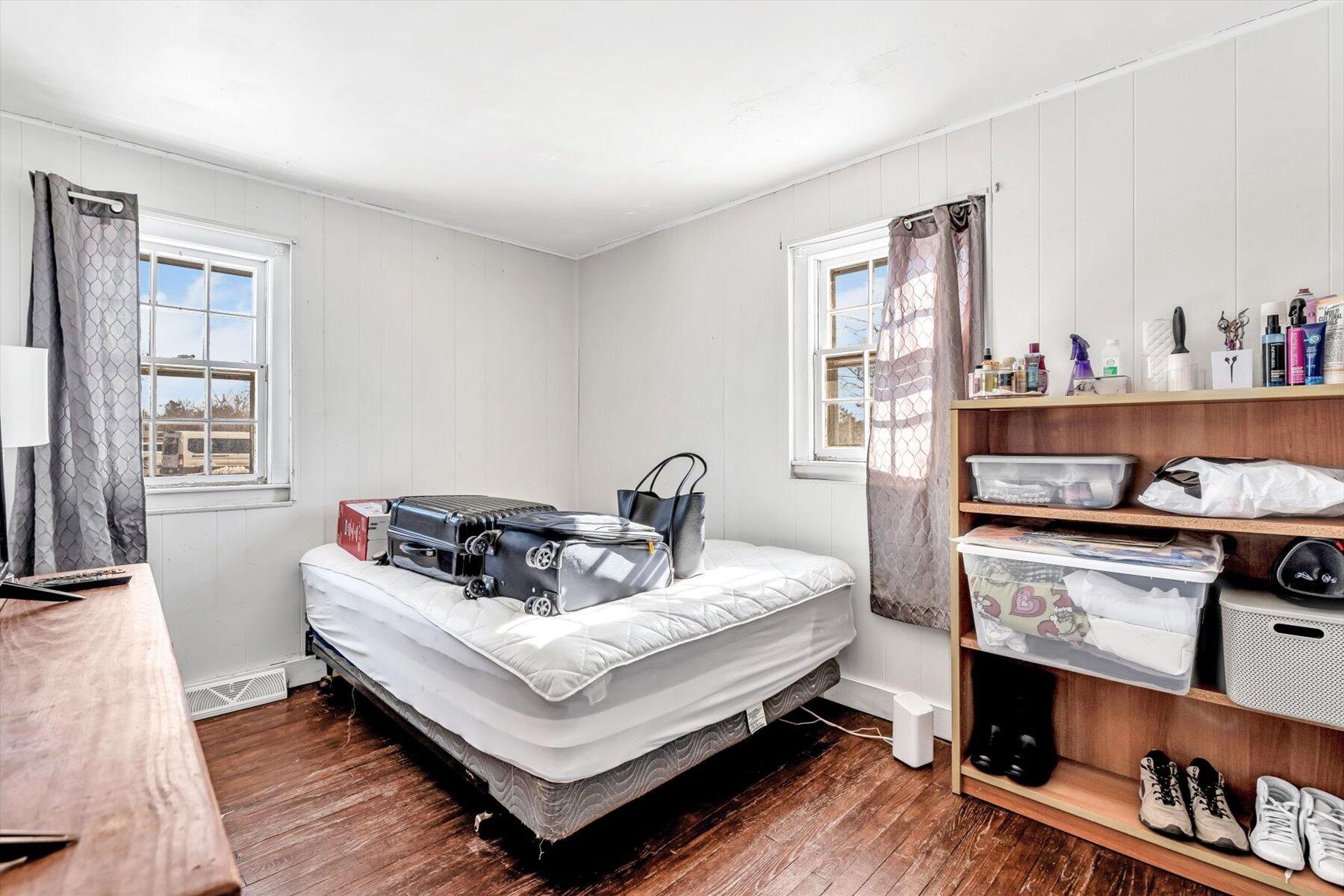 97 Bassett Lane Hyannis, MA 02601 - Photo 12 of 24 a bed room with a bed and a window
