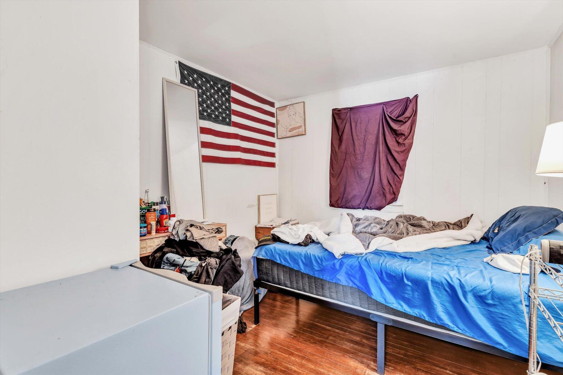 97 Bassett Lane Hyannis, MA 02601 - Photo 14 of 24 a room with furniture and a wooden floor