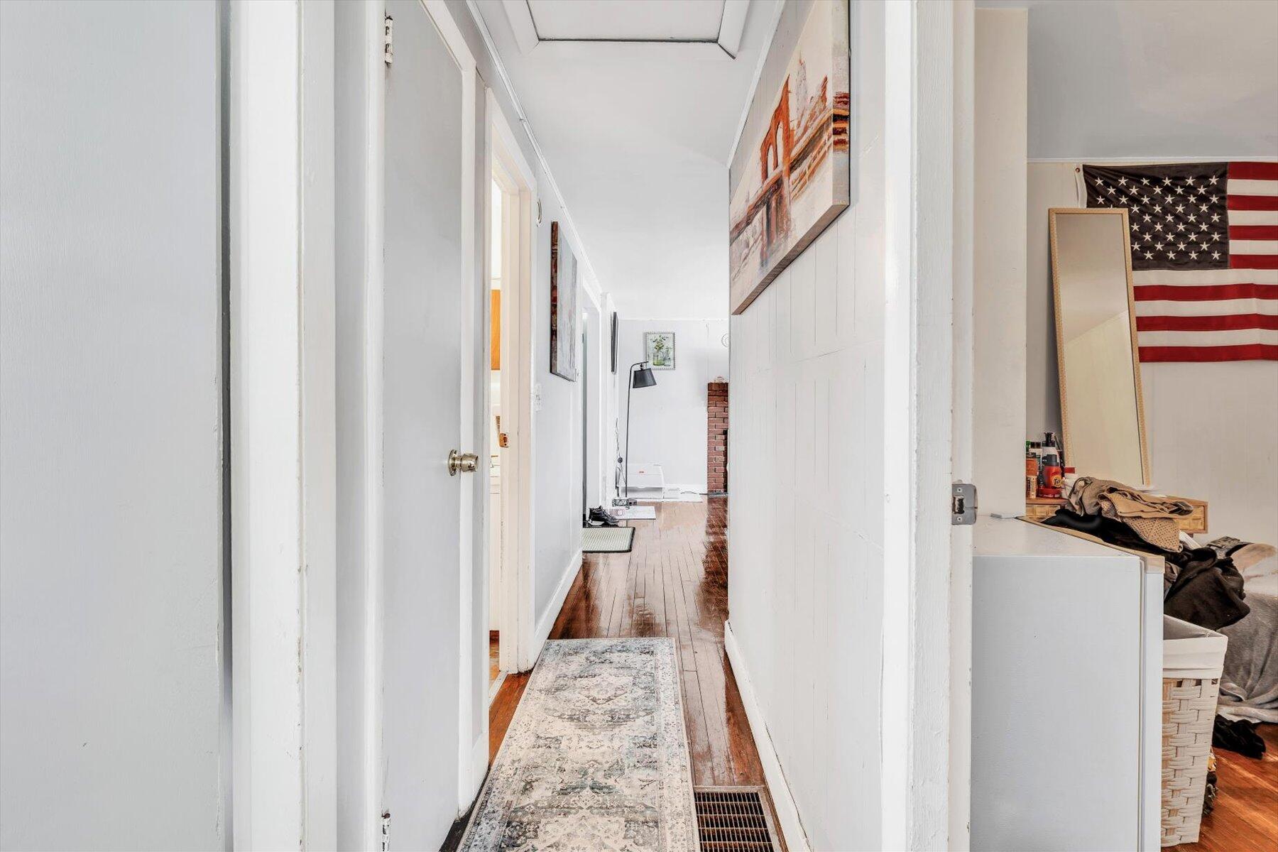 97 Bassett Lane Hyannis, MA 02601 - Photo 15 of 24 a view of a hallway with a white car parked in a corridor