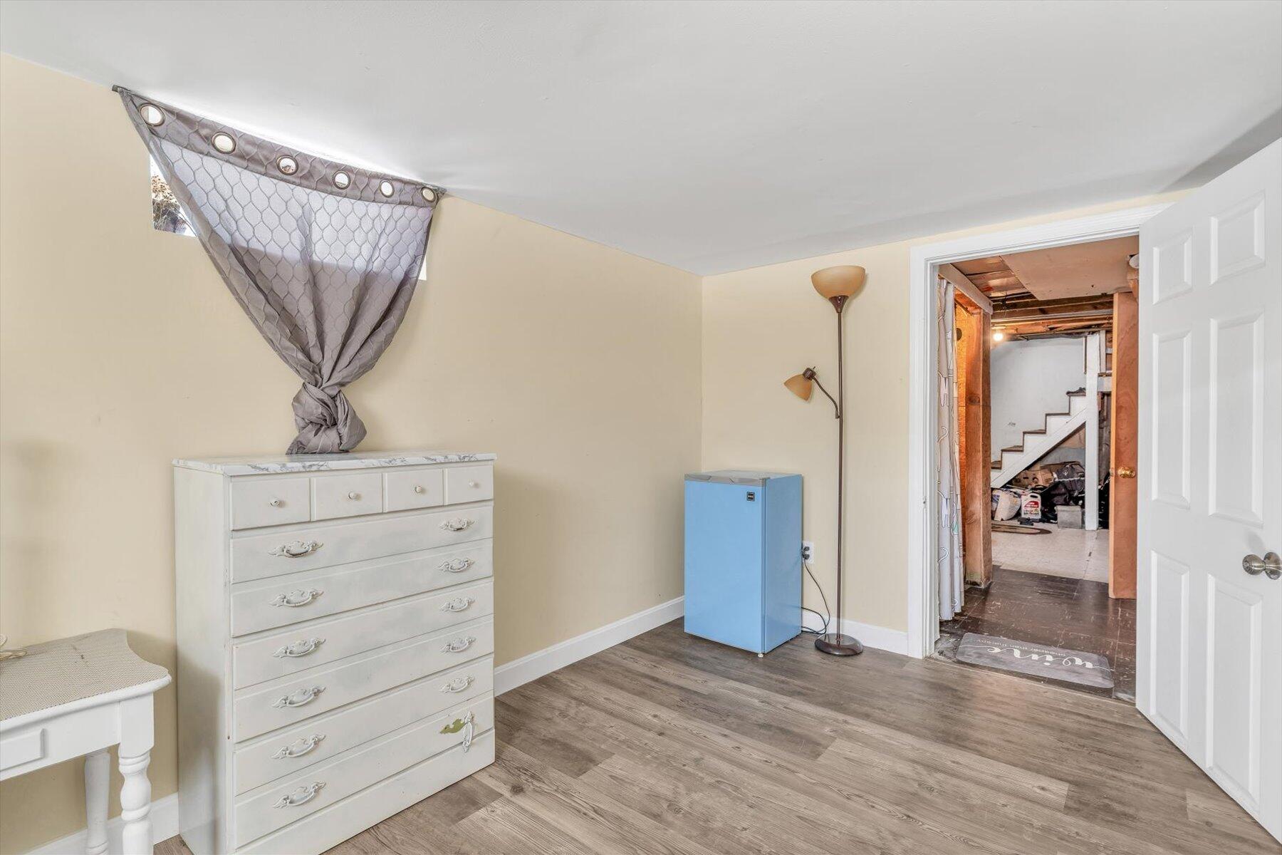 97 Bassett Lane Hyannis, MA 02601 - Photo 16 of 24 wooden floor in an empty room