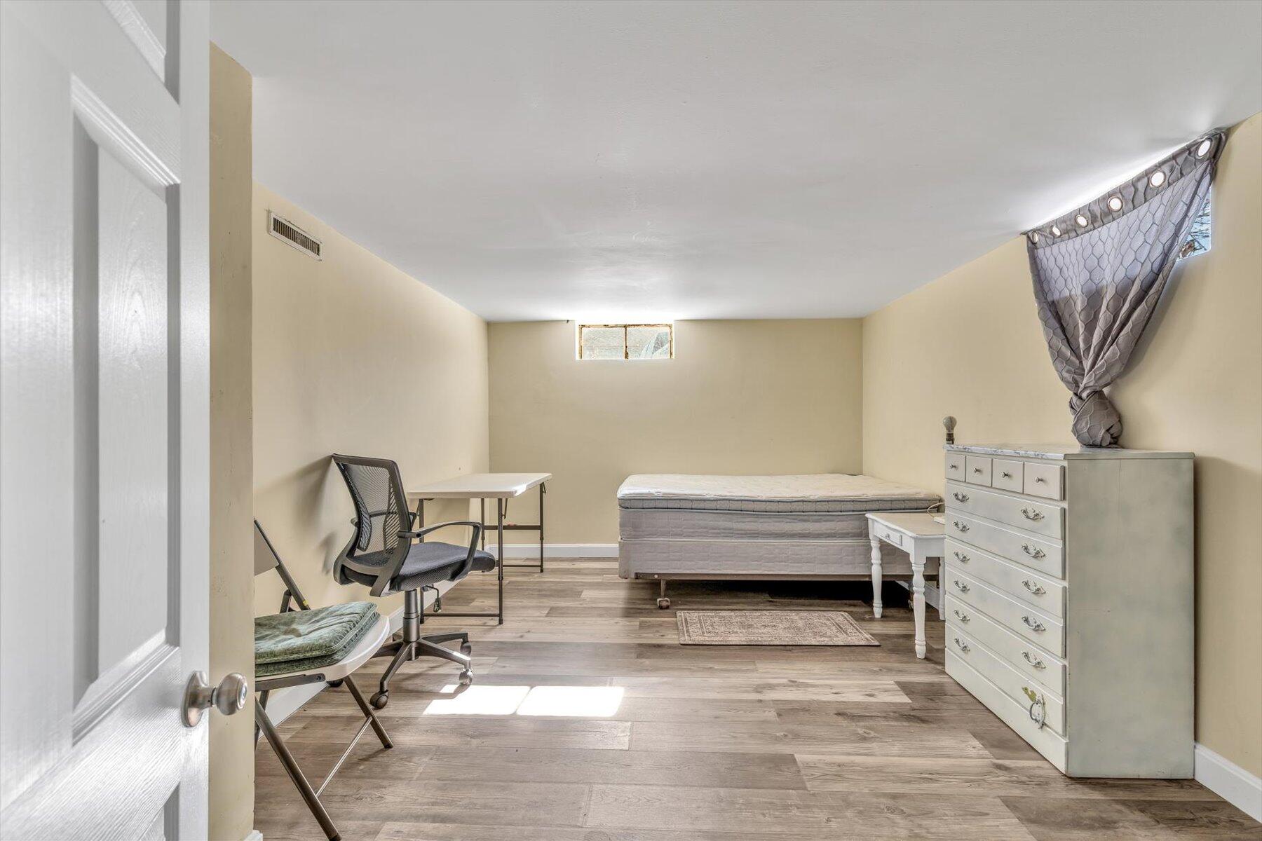 97 Bassett Lane Hyannis, MA 02601 - Photo 17 of 24 a bedroom with furniture and a window