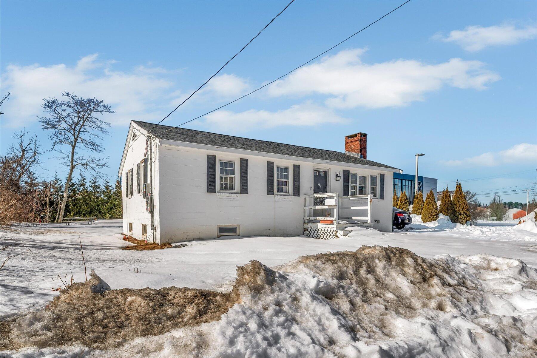 97 Bassett Lane Hyannis, MA 02601 - Photo 24 of 24 a view of a house with snow in the background