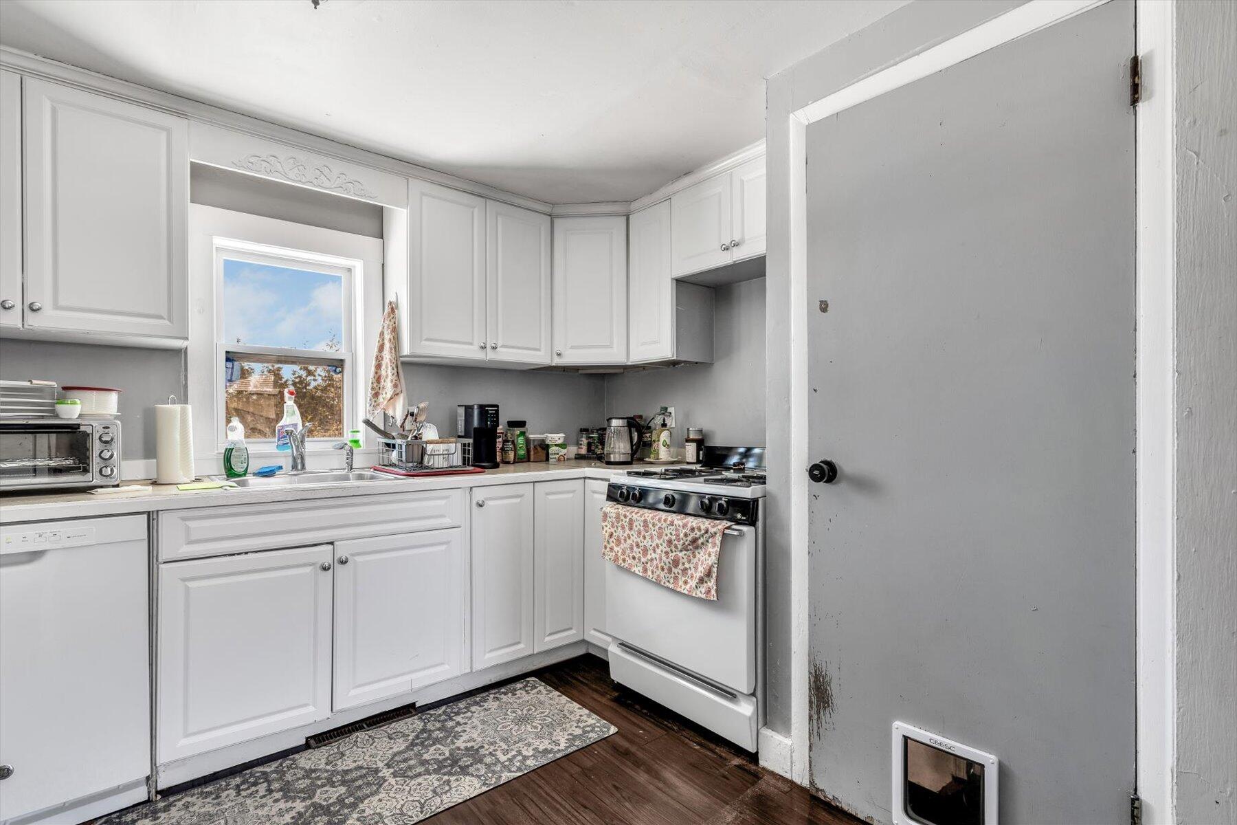 97 Bassett Lane Hyannis, MA 02601 - Photo 7 of 24 a kitchen with stainless steel appliances granite countertop a sink and cabinets