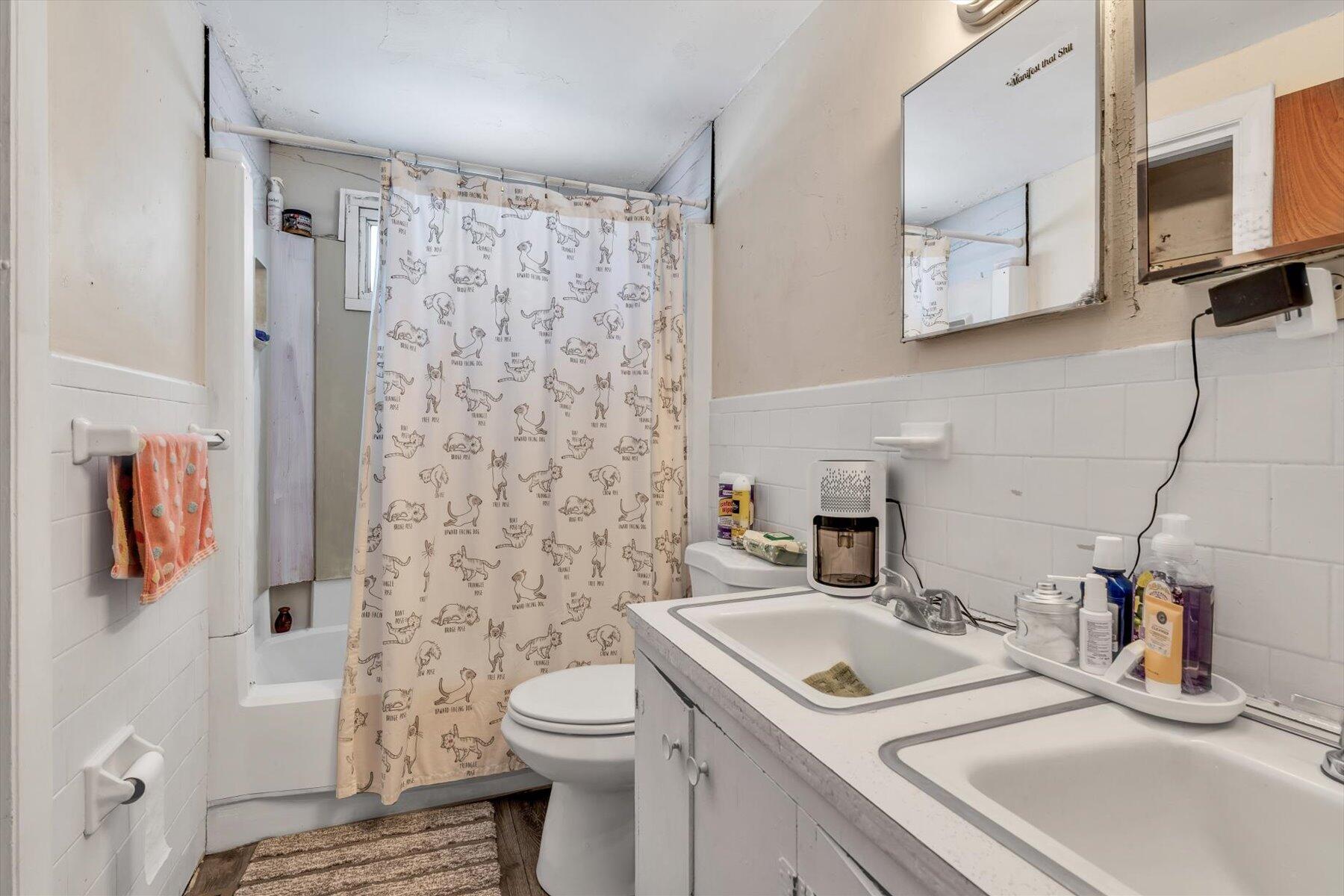 97 Bassett Lane Hyannis, MA 02601 - Photo 9 of 24 a bathroom with a sink toilet and shower