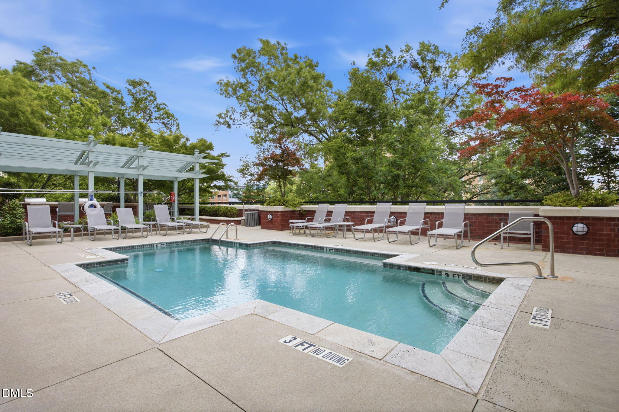 618 North Boylan Avenue, Unit 800 Raleigh, NC 27603 - Photo 17 of 25 a view of a swimming pool with a lounge chairs