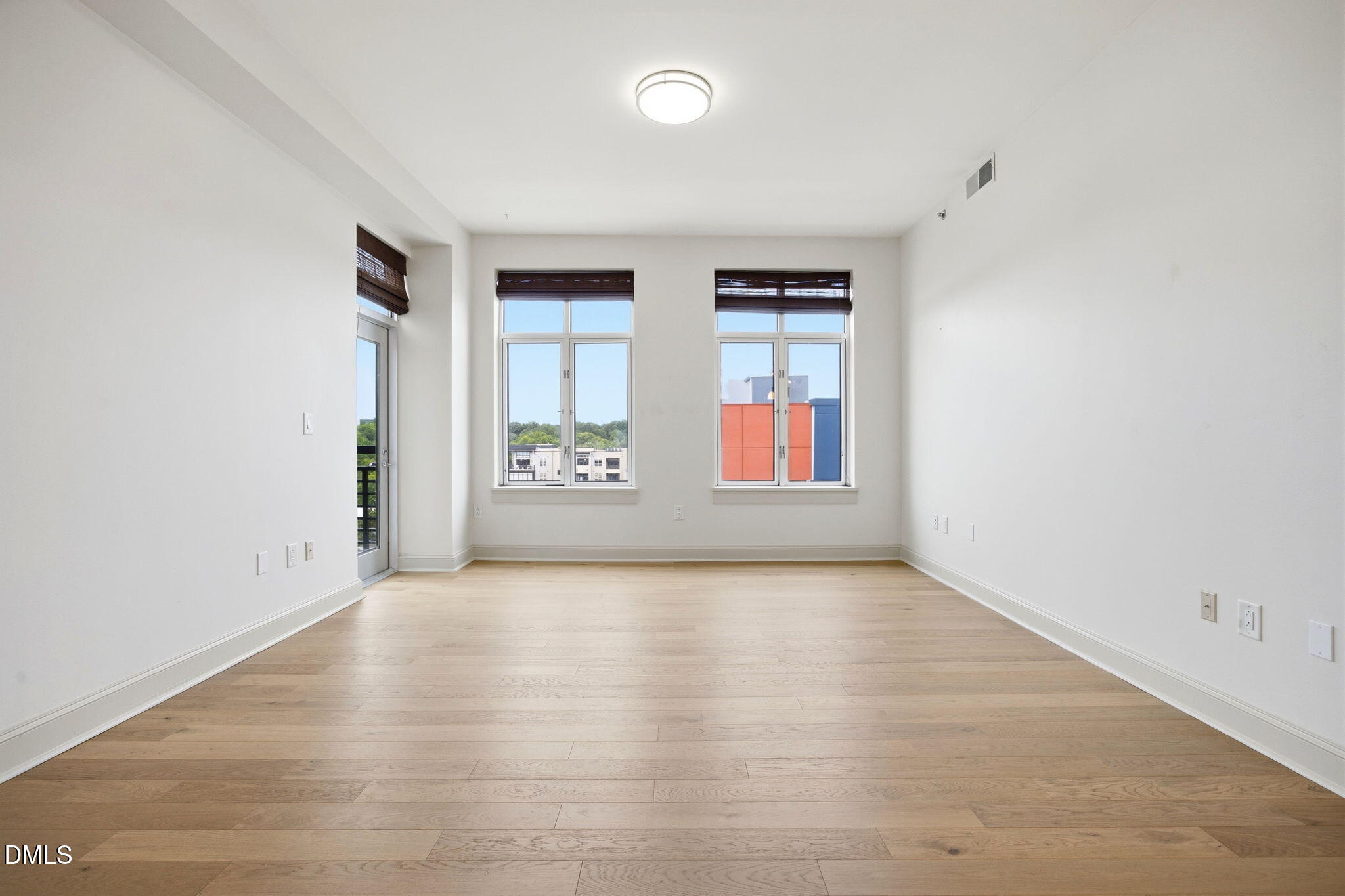 618 North Boylan Avenue, Unit 800 Raleigh, NC 27603 - Photo 7 of 25 an empty room with windows and closet