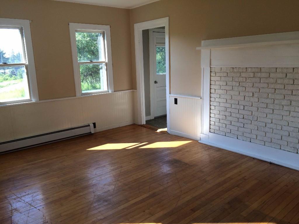143 Tremont Road Bass Harbor, ME 04653 - Photo 11 of 29 Living room with wood floors and...