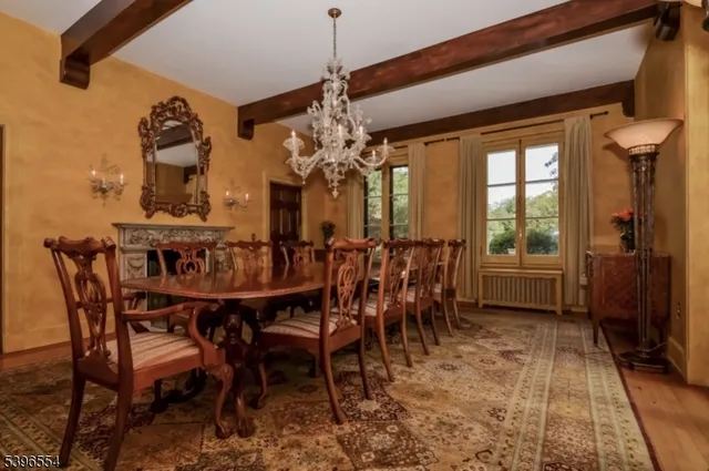 a view of a dining room with furniture and window