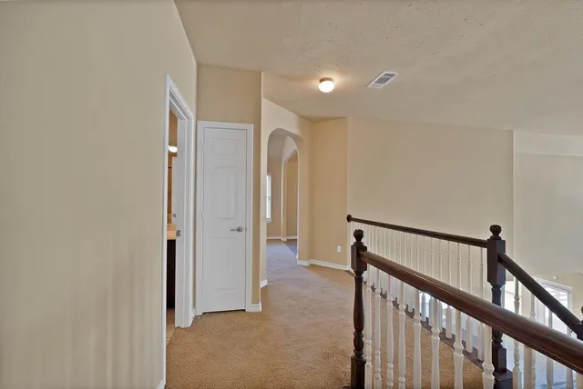 a view of hallway with stairs