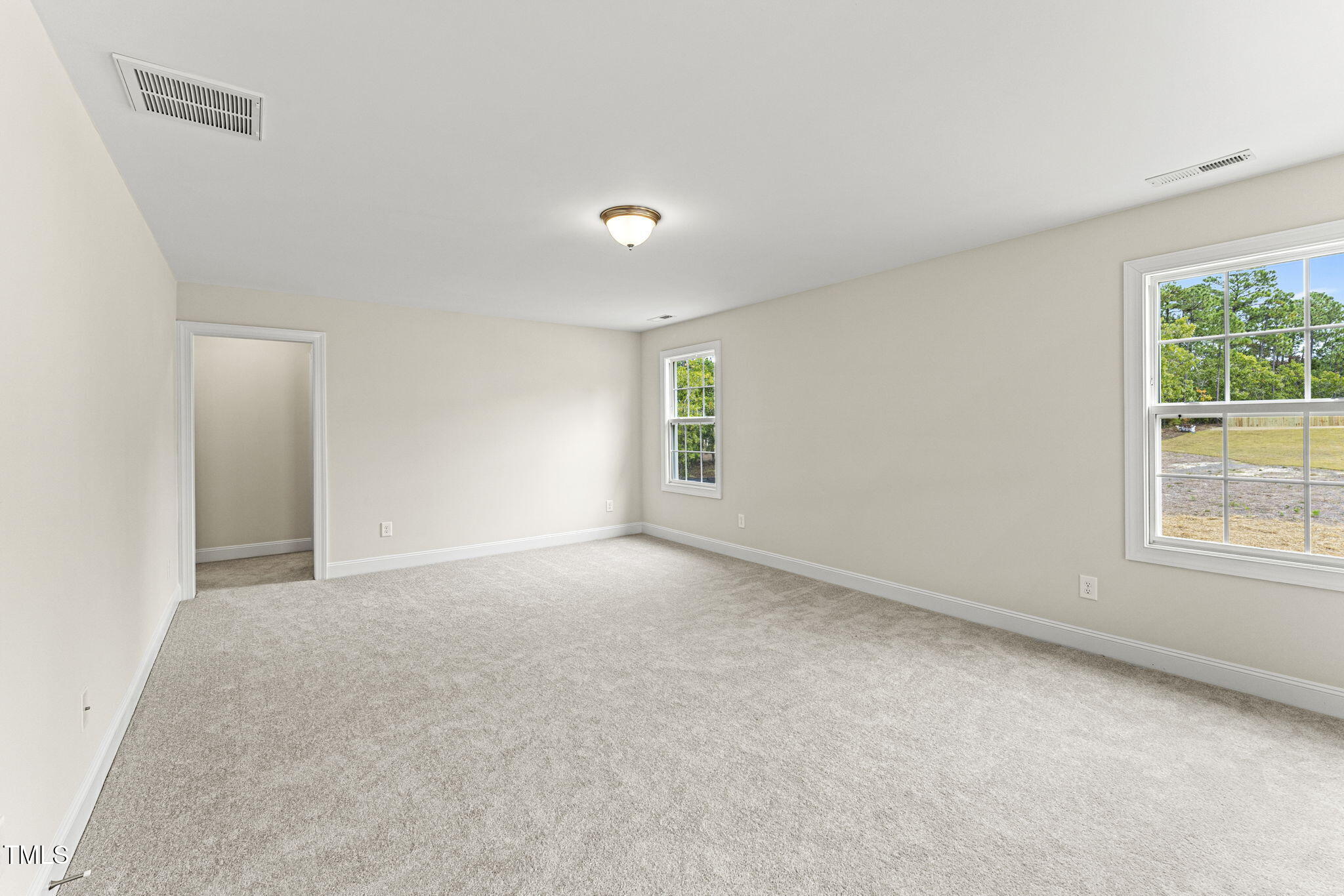 134 Ivy Rdg Road Chapel Hill, NC 27516 - Photo 22 of 37 an empty room with windows