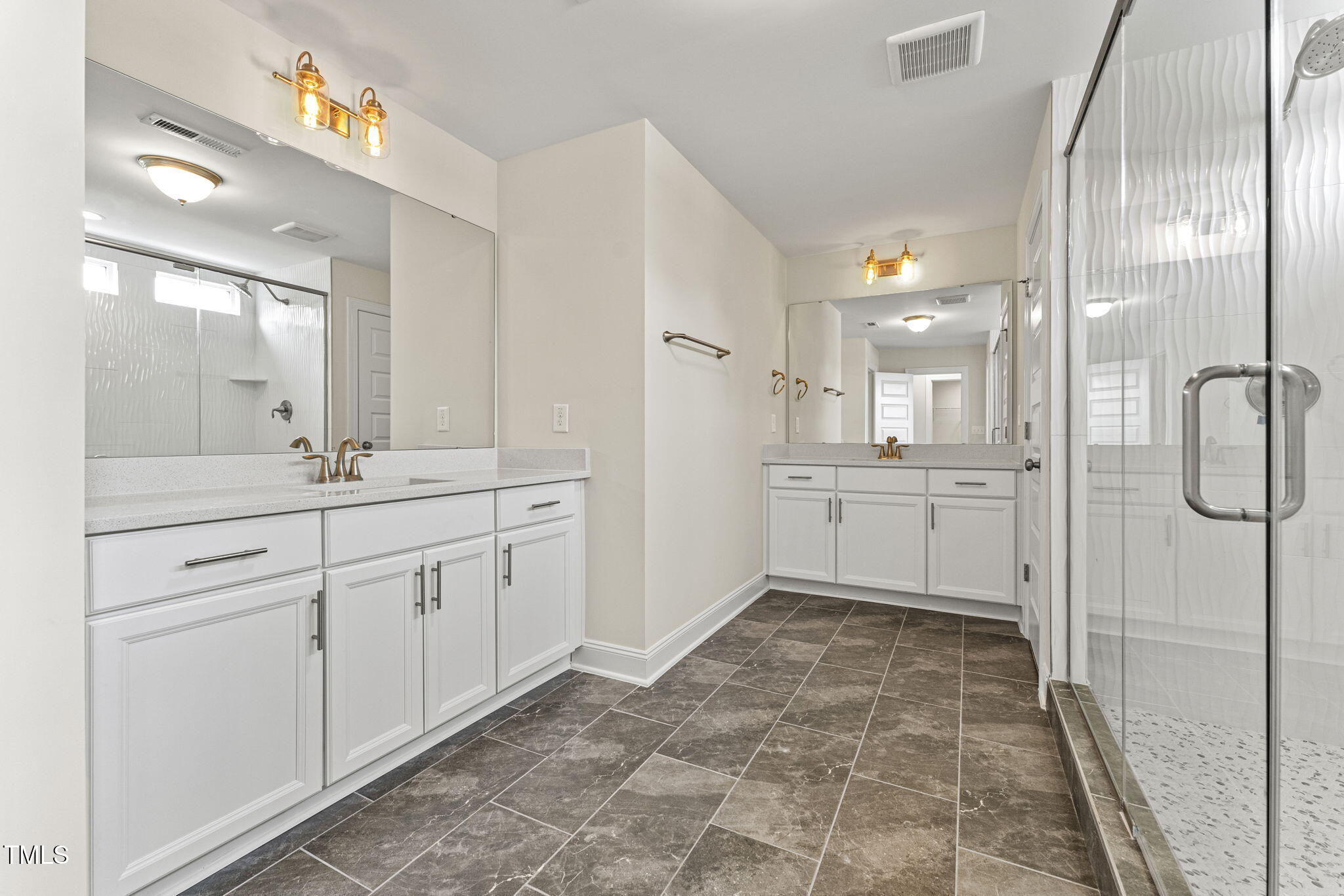 134 Ivy Rdg Road Chapel Hill, NC 27516 - Photo 23 of 37 a spacious bathroom with a shower sink and a mirror