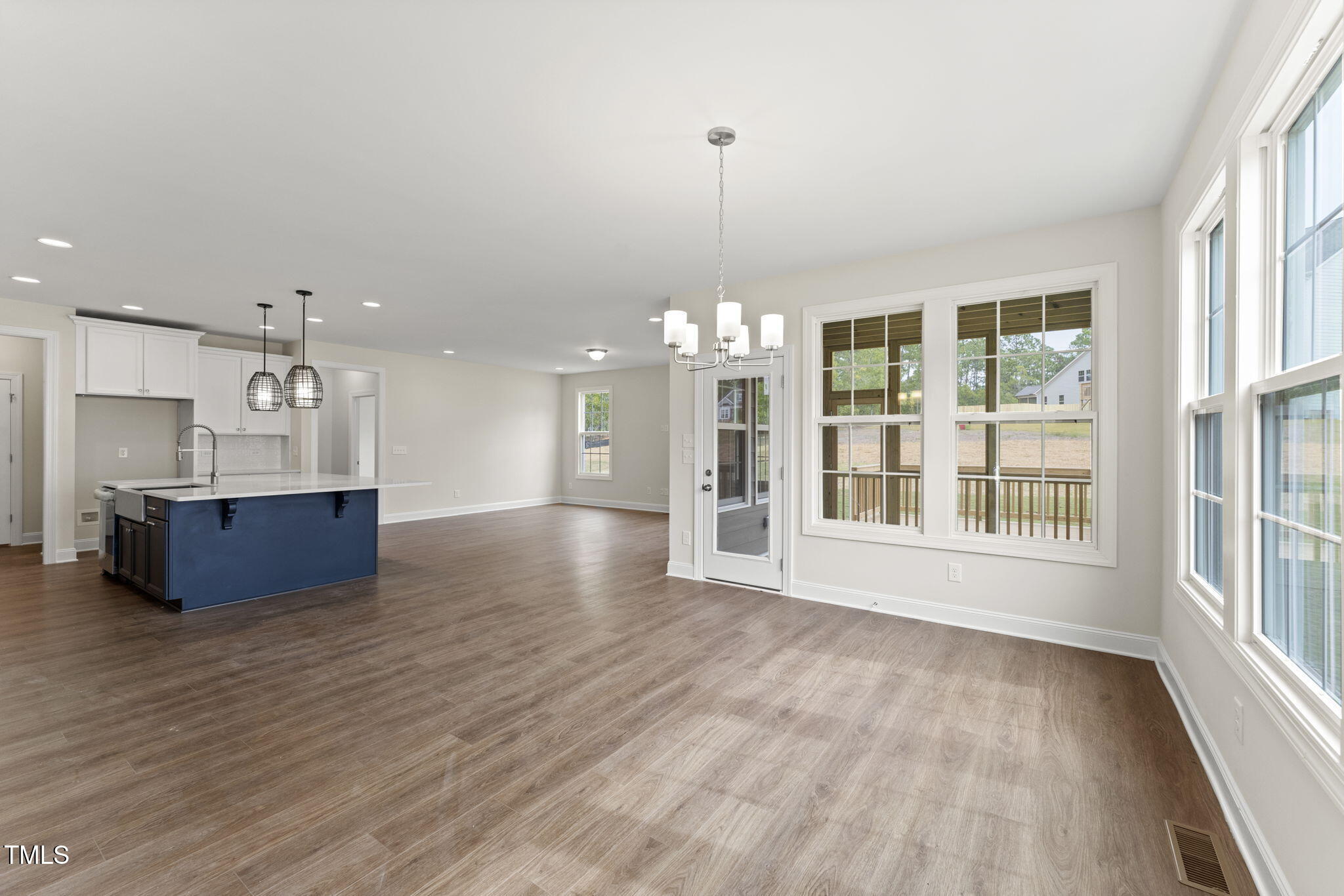 134 Ivy Rdg Road Chapel Hill, NC 27516 - Photo 7 of 37 a view of a big room with wooden floor and windows