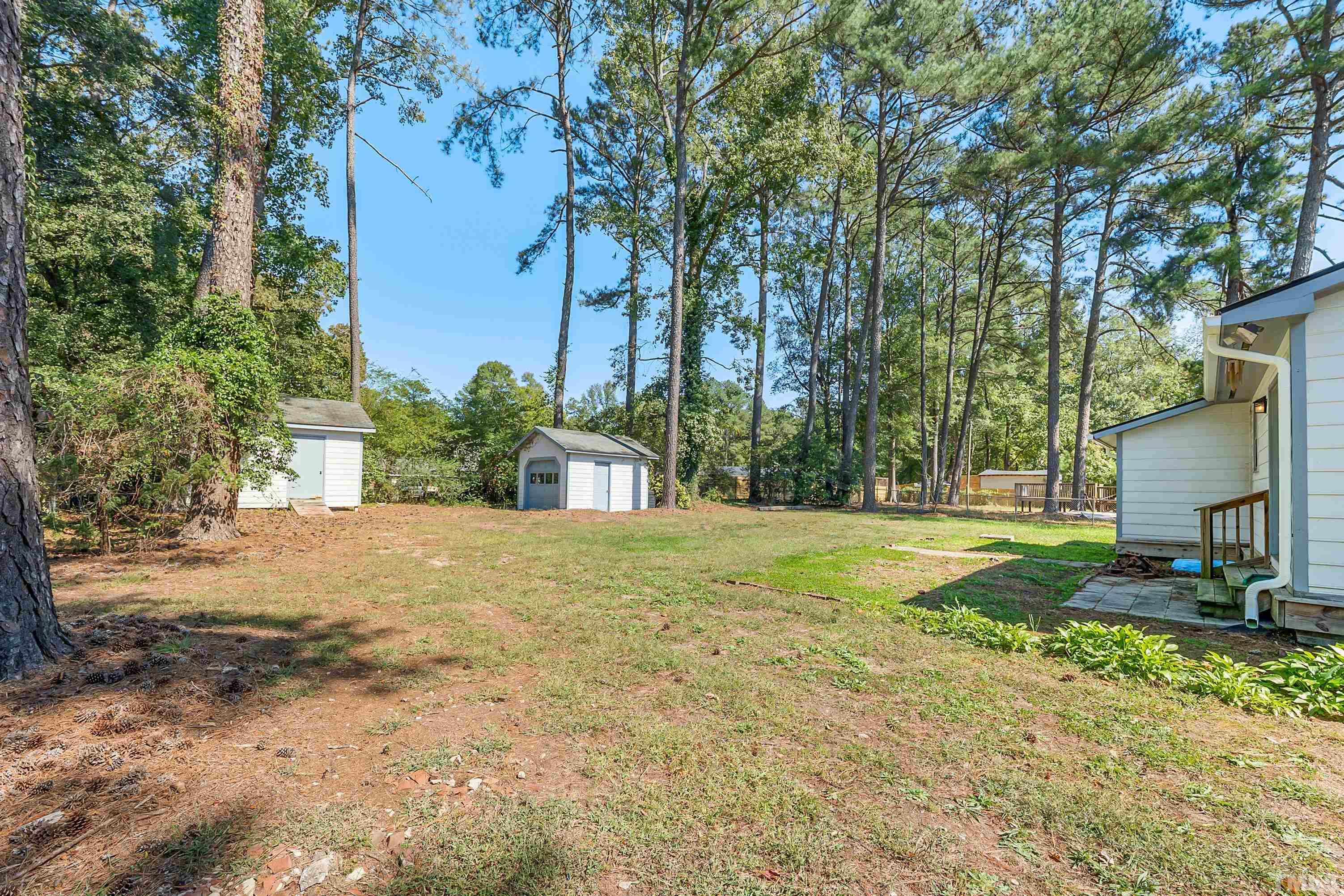 6301 Poole Road Raleigh, NC 27610 - Photo 17 of 20 a view of a yard with plants and trees
