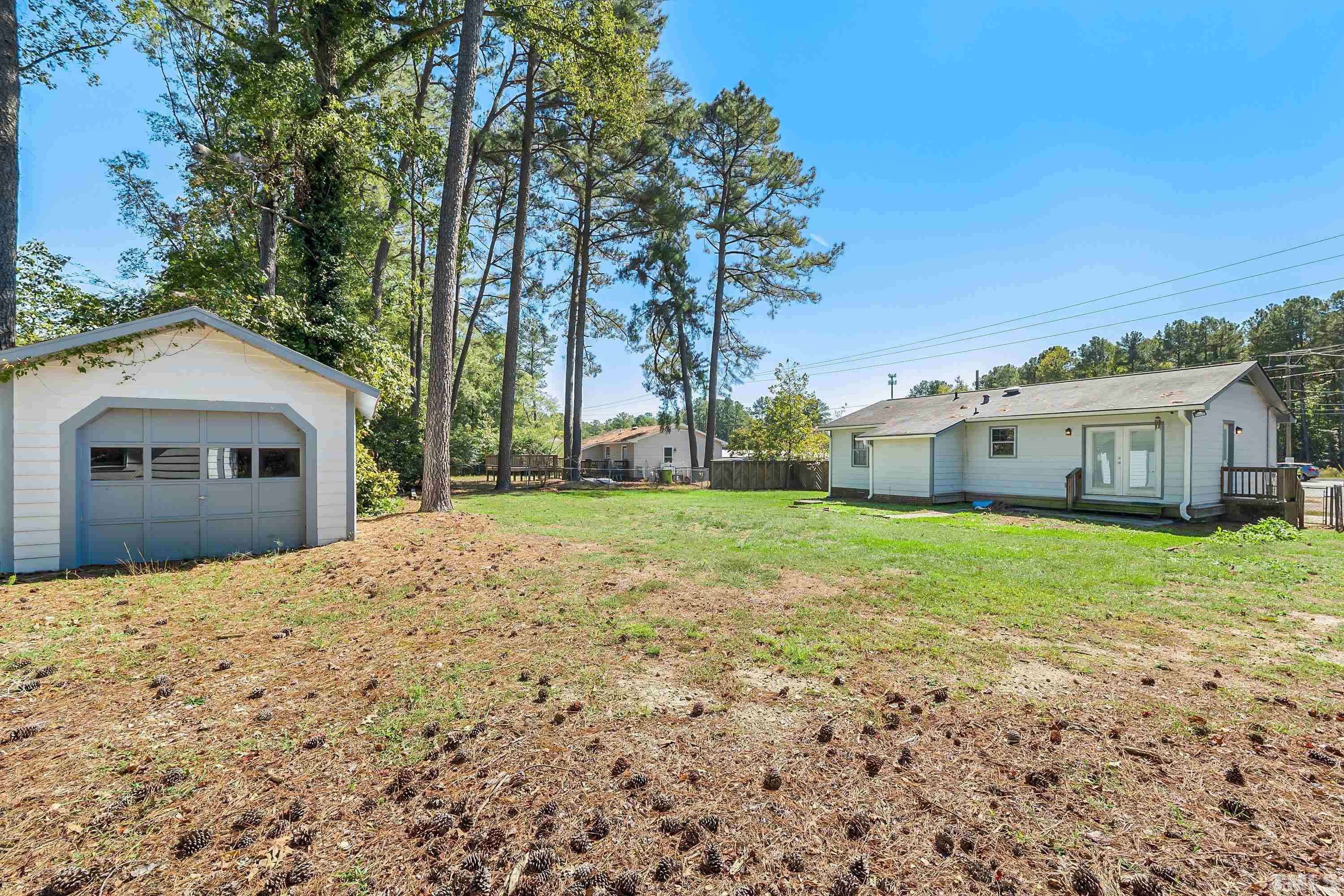 6301 Poole Road Raleigh, NC 27610 - Photo 18 of 20 a front view of a house with a yard and garage