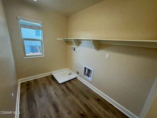 a view of an empty room with windows