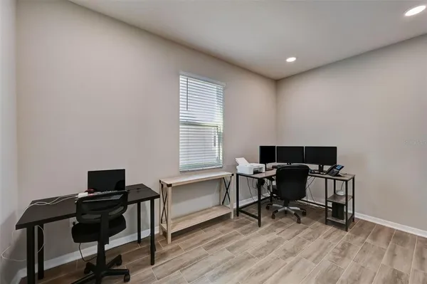 a workspace with furniture and a window