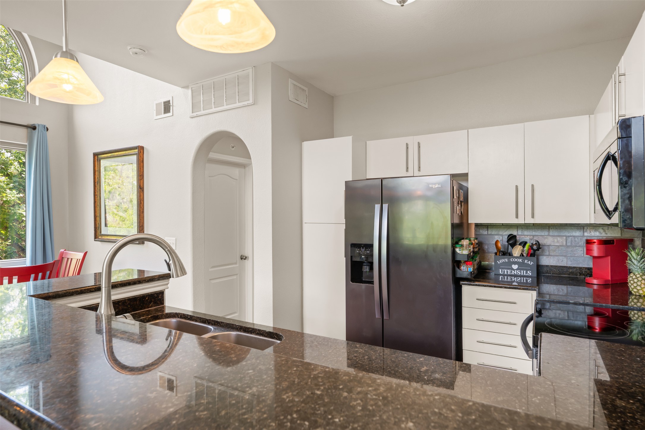 11203 Ranch Road 2222, Unit 1407 Austin, TX 78732 - Photo 23 of 40 The kitchen comes ready to use for the home chef with durable granite countertops complimented by tasteful tile backsplash.