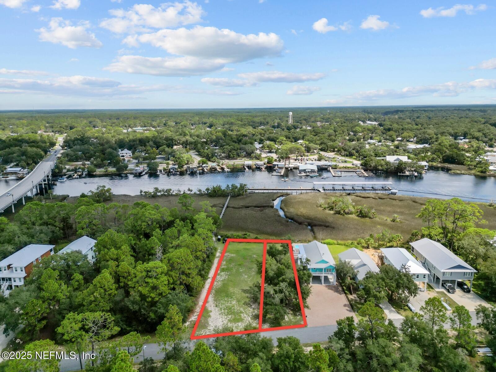 0 Southwest 279th Avenue Steinhatchee, FL 32359 - Photo 1 of 20 an aerial view of residential houses with outdoor space and swimming pool