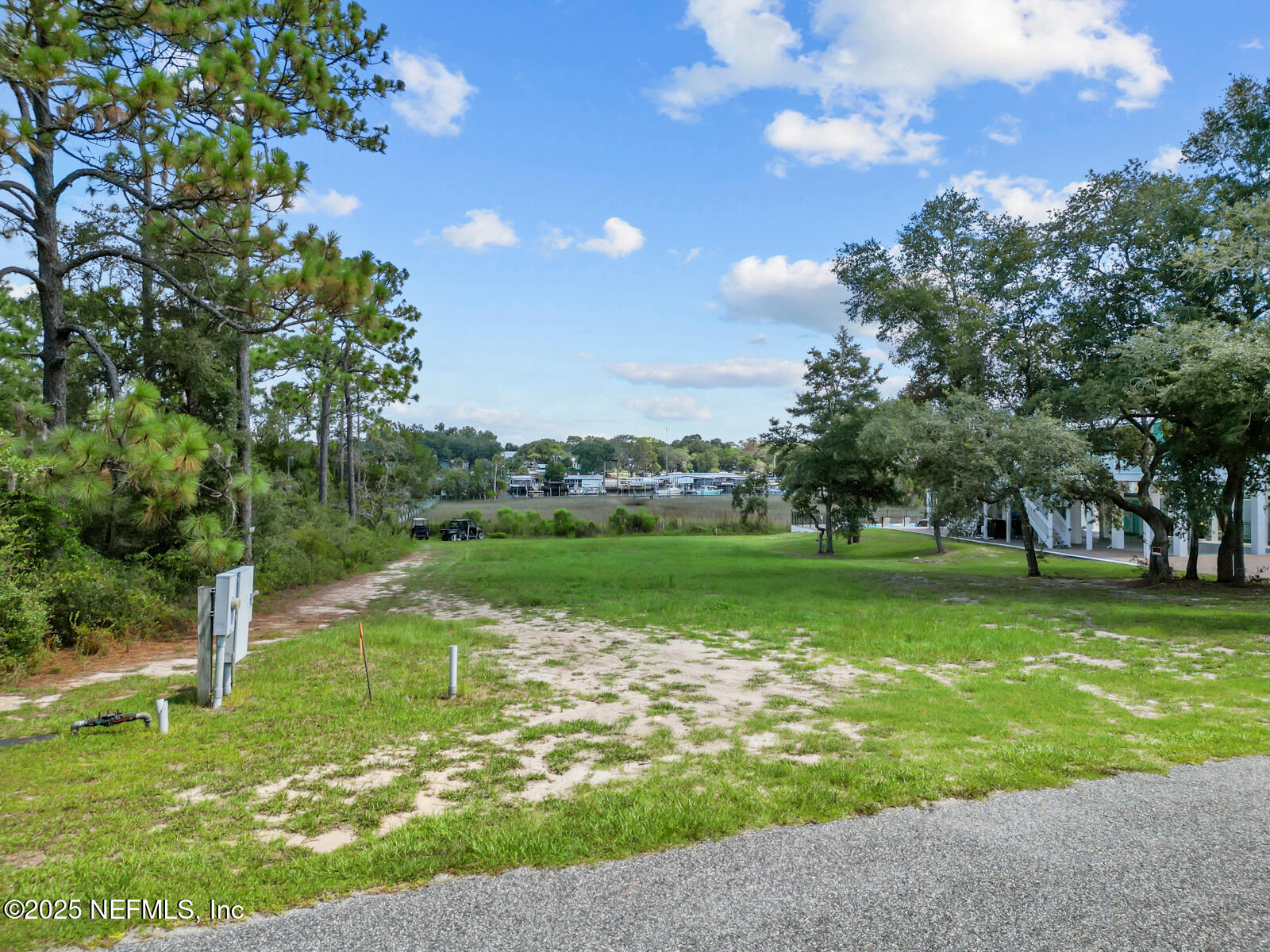 0 Southwest 279th Avenue Steinhatchee, FL 32359 - Photo 5 of 20 a view of a golf course with a lake view