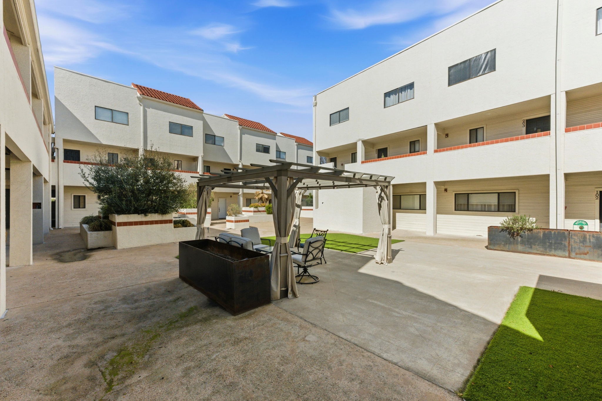 a view of a building with sitting area