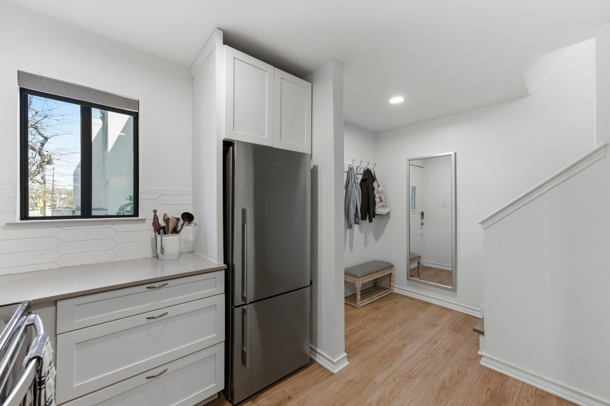 2605 Enfield Road, Unit 218 Austin, TX 78703 - Photo 12 of 26 a kitchen with a refrigerator and a sink