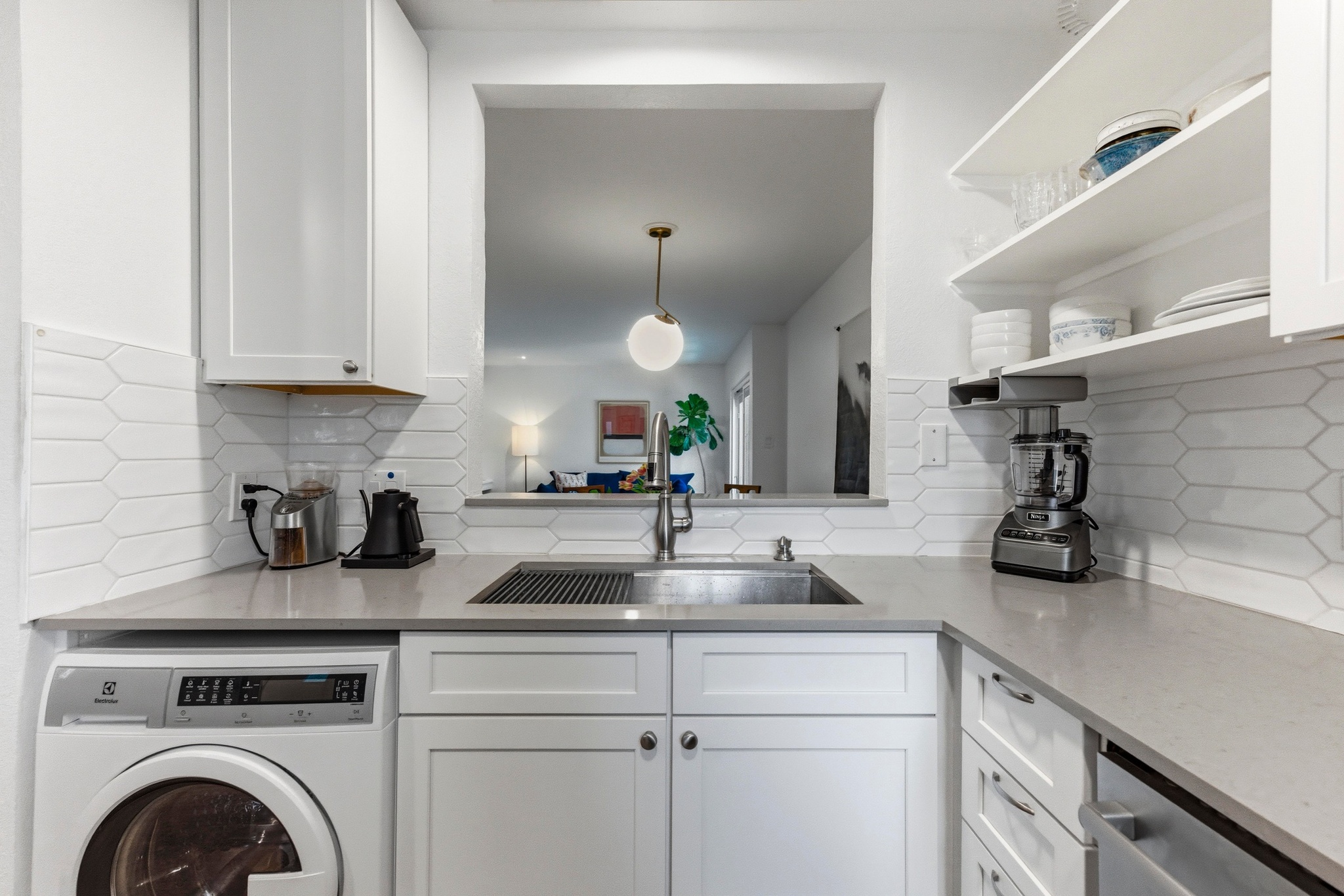 2605 Enfield Road, Unit 218 Austin, TX 78703 - Photo 14 of 26 a kitchen with sink a stove and cabinets