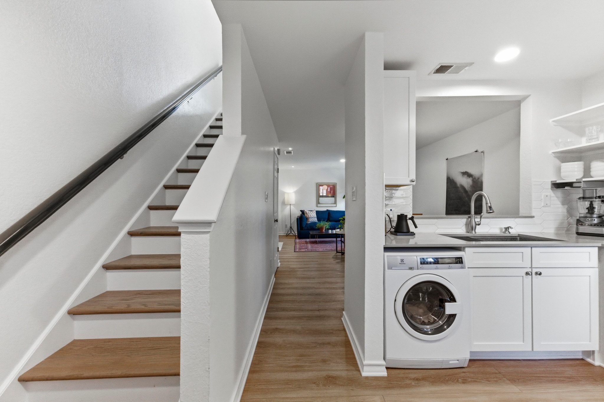 2605 Enfield Road, Unit 218 Austin, TX 78703 - Photo 15 of 26 a view of a hallway with washer and dryer