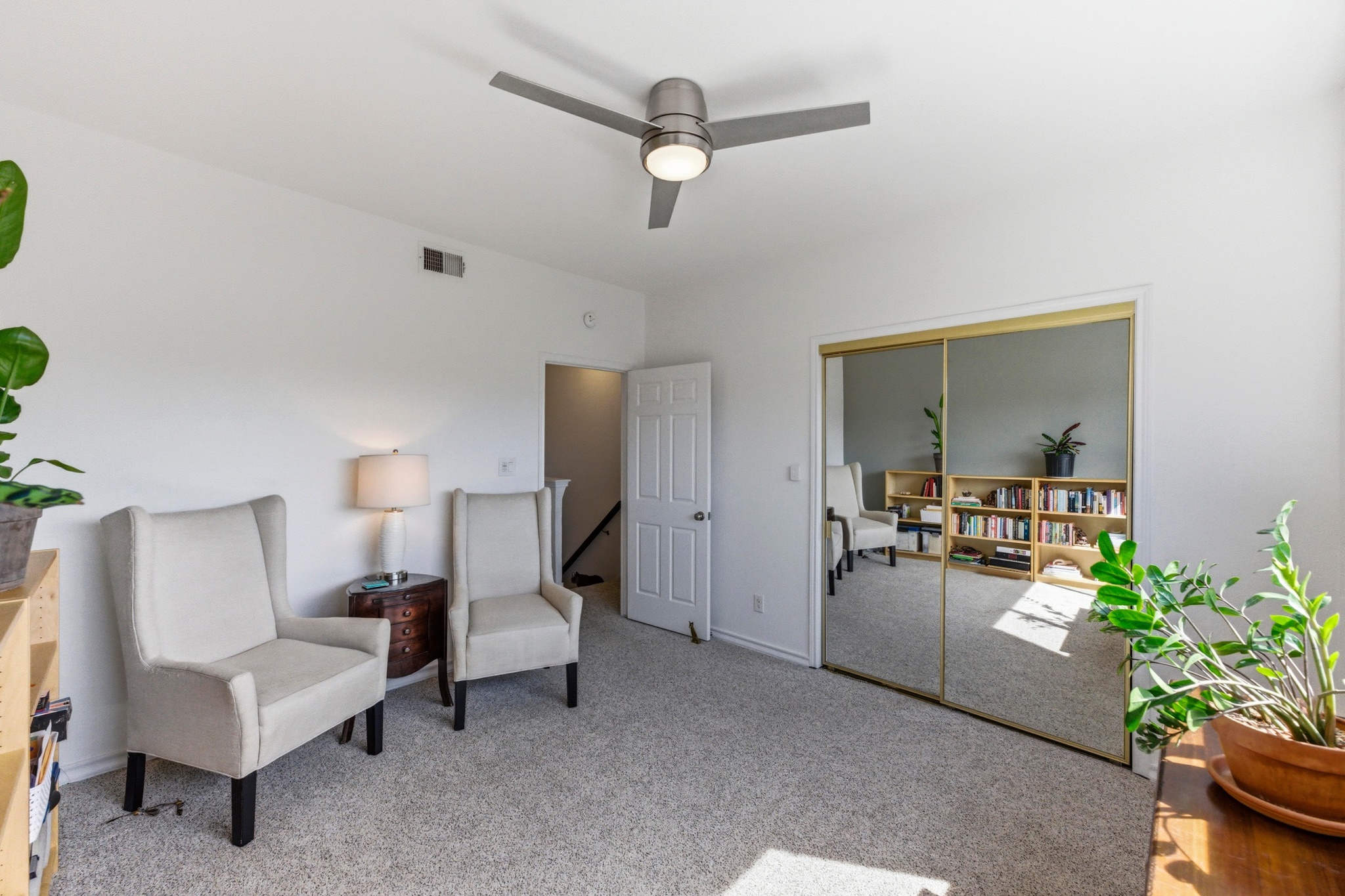 2605 Enfield Road, Unit 218 Austin, TX 78703 - Photo 17 of 26 a living room with furniture and a potted plant