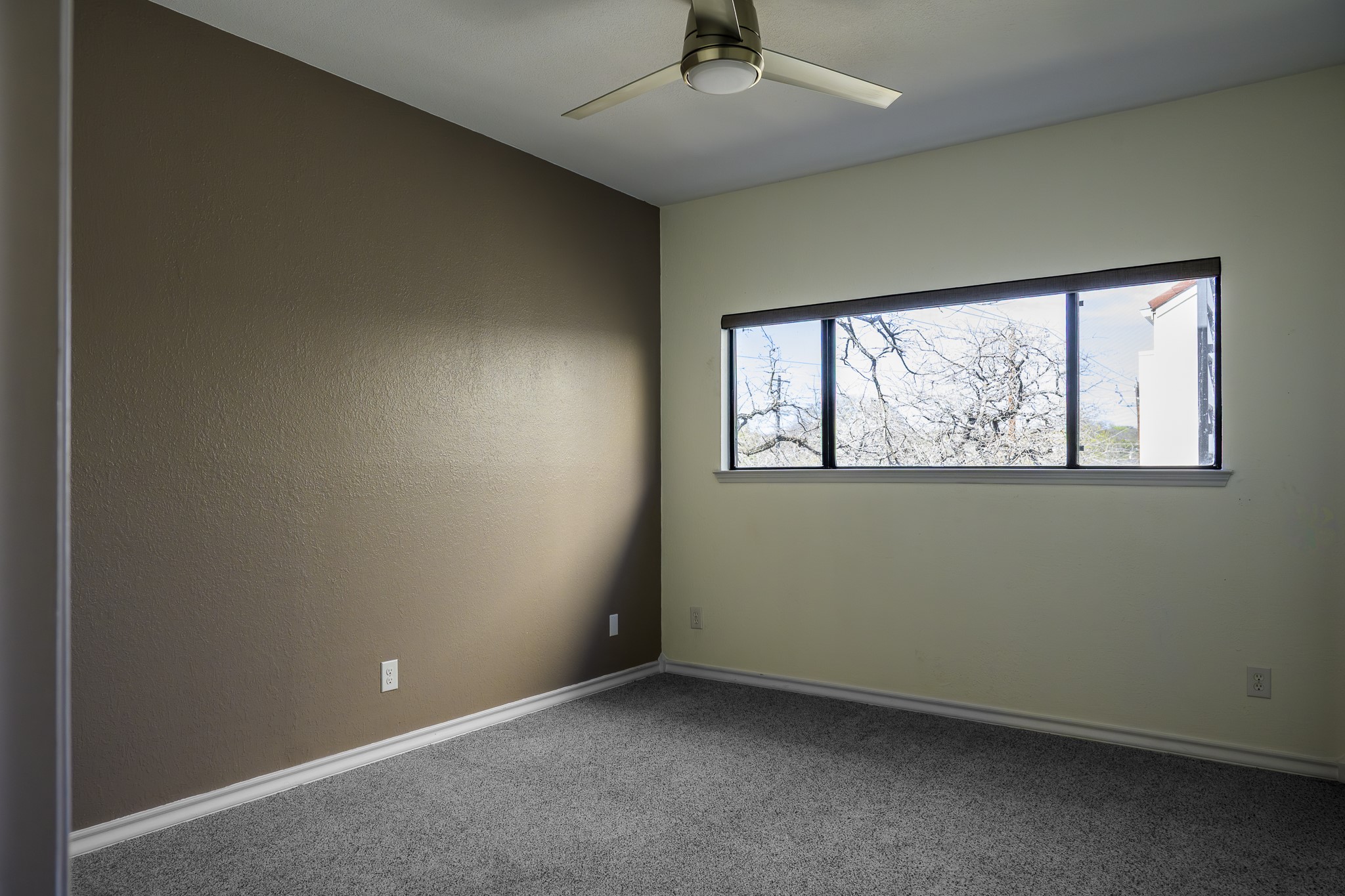 2605 Enfield Road, Unit 218 Austin, TX 78703 - Photo 18 of 26 an empty room with a window