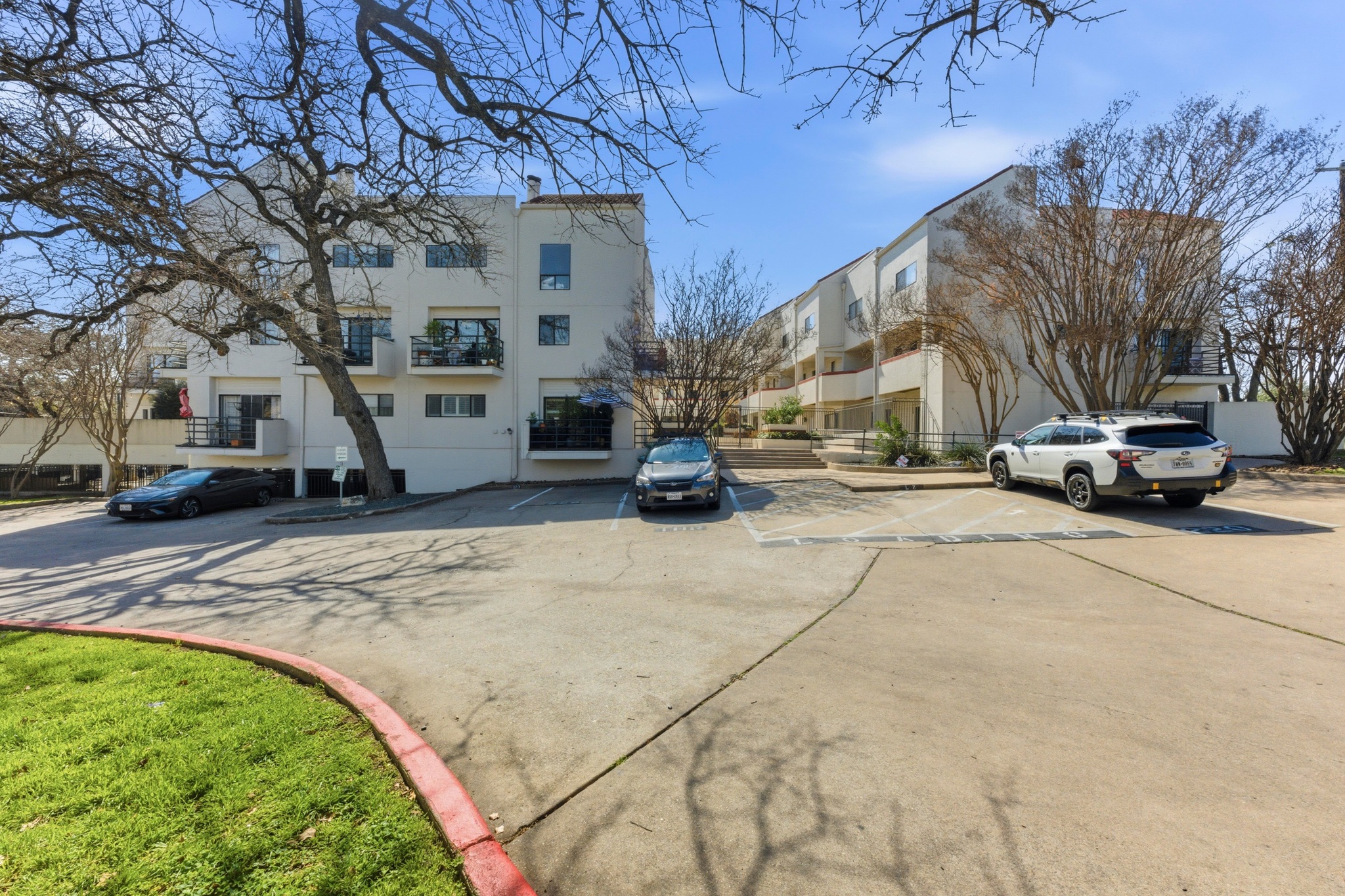 2605 Enfield Road, Unit 218 Austin, TX 78703 - Photo 2 of 26 a view of street with parked cars