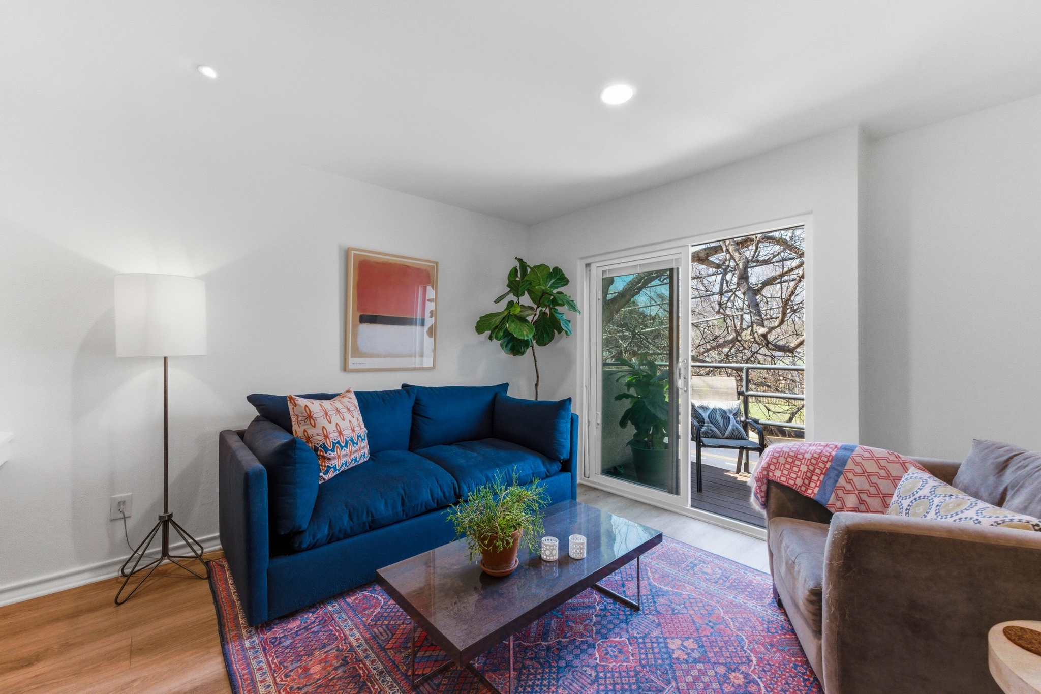 2605 Enfield Road, Unit 218 Austin, TX 78703 - Photo 5 of 26 a living room with furniture and a large window