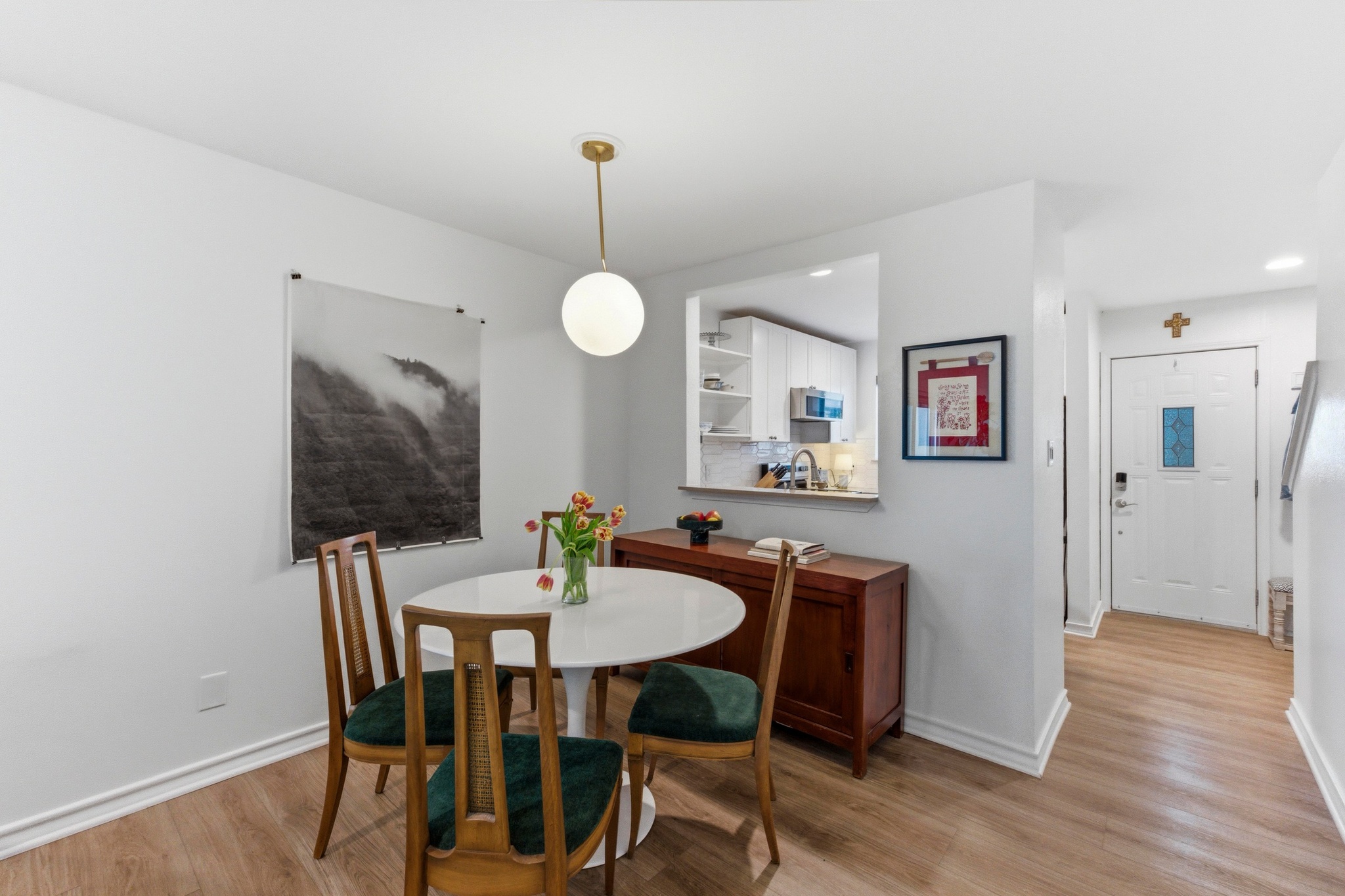 2605 Enfield Road, Unit 218 Austin, TX 78703 - Photo 7 of 26 a view of a dining room with furniture wooden floor and chandelier