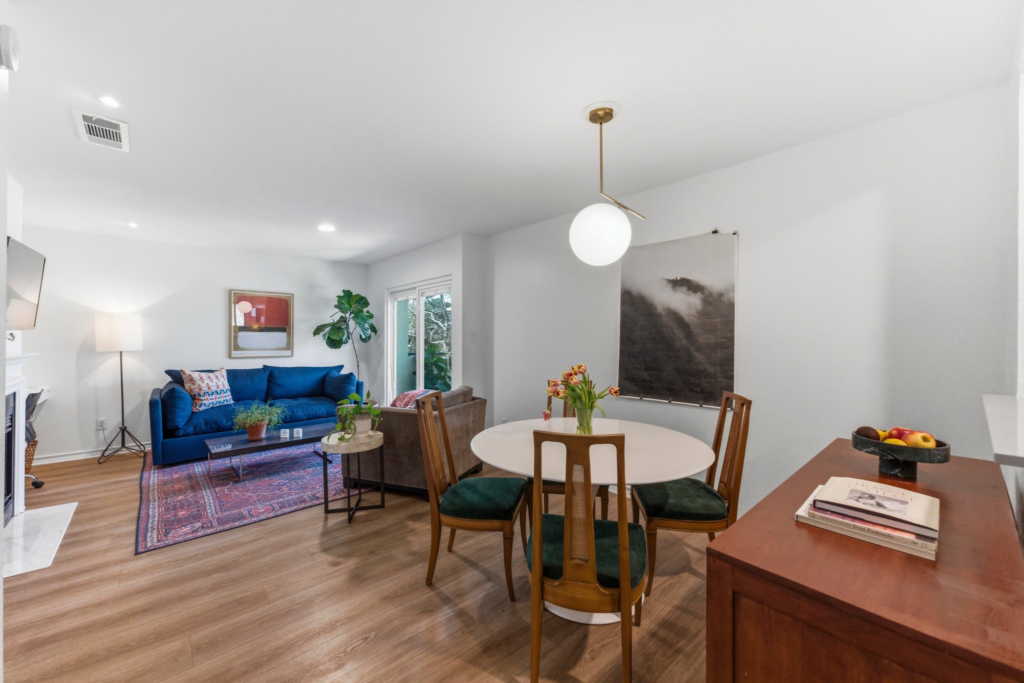 2605 Enfield Road, Unit 218 Austin, TX 78703 - Photo 9 of 26 a living room with furniture and a wooden floor
