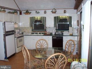 80 Pinehurst Road Ocean Pines, MD 21811 - Photo 3 of 9 a kitchen with stainless steel appliances a stove a sink and a microwave
